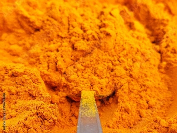 Obraz Turmeric powder on spoon close up