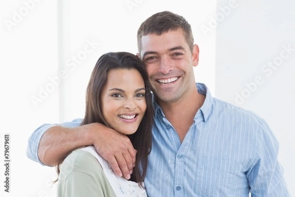 Fototapeta Loving couple smiling at home