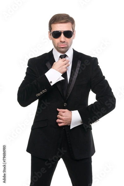 Fototapeta Stylish bodyguard with sunglasses. Isolated over white backgroun