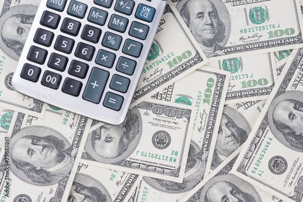 Fototapeta U. S. Dollars and calculator. Studio shot.