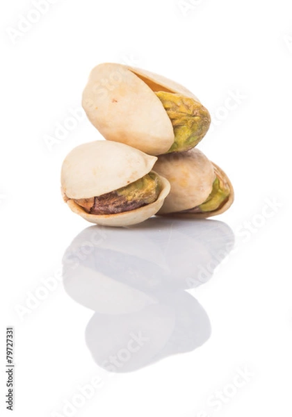 Fototapeta Pistachio nuts over white background