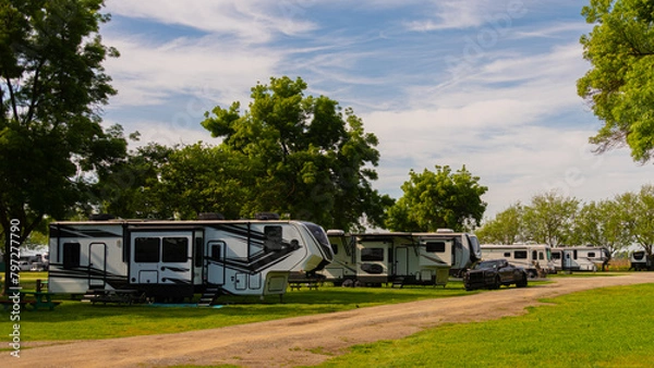 Obraz Large Rv trailers parked at campsite on grass