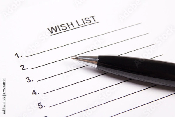 Fototapeta close up of blank wish list and pen