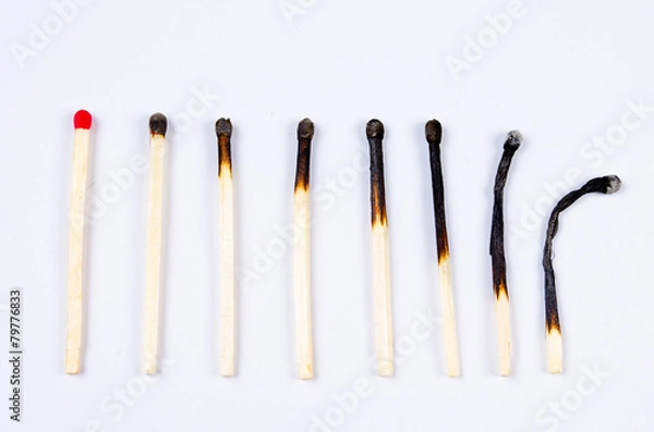 Fototapeta matches in different stages of burning on white