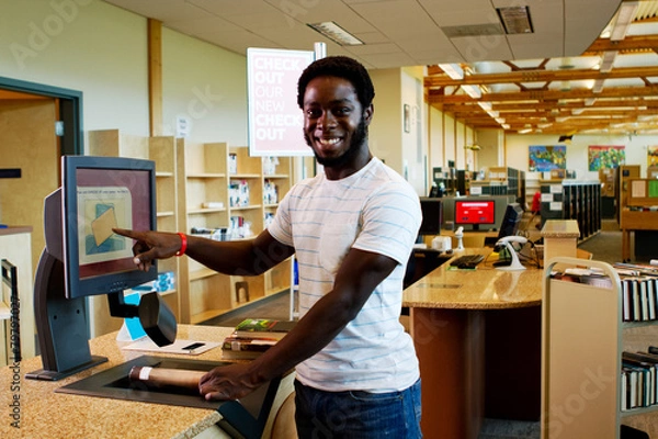 Obraz Librarian checking out books