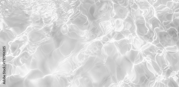 Fototapeta Realistic Water Surface Overlay. Transparent Background with Detailed Ripples and Caustic Light Effects on a Crystal-Clear Water Surface.