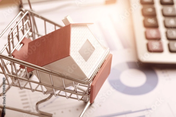 Obraz Calculator on data drawing report and small house model placed in shopping cart