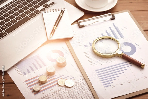 Obraz The concept of financial and economic data growth - financial data report analysis scenario placed on the desk