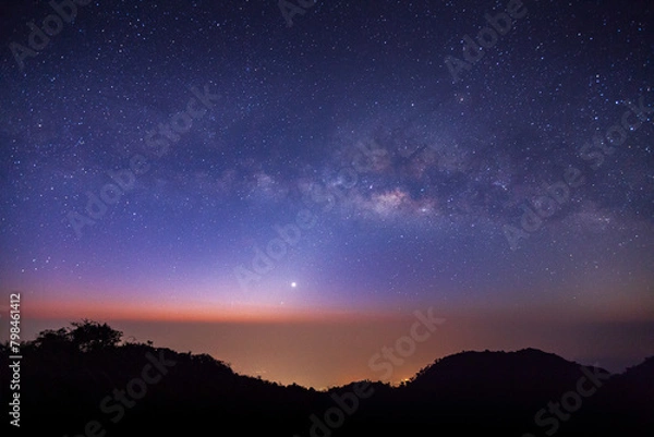 Fototapeta landscape silhouette tree on high moutain before sunrise with milky way galaxy