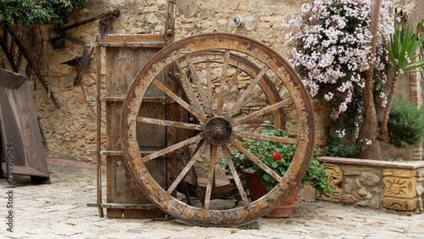 Fototapeta An old wheelbarrow on the farm as a decorative object