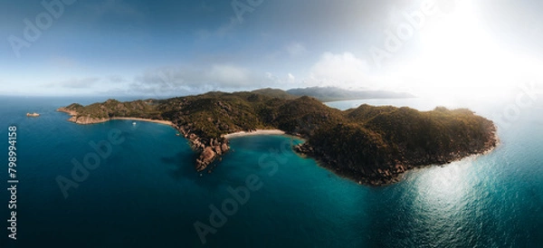 Fototapeta Radical Bay Beach at Arcadia at Magnetic Island near Townsville in Queensland, Australia - Aerial drone footage with rocks, waves, cliffs, ocean, trees, coast, views and scenery.