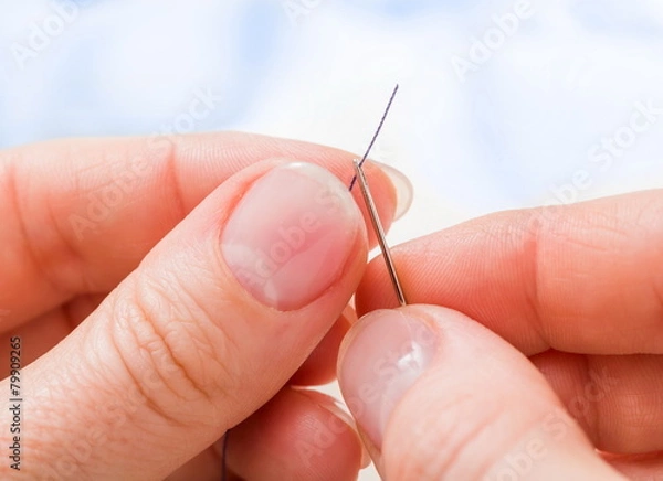 Obraz Macro of threading a needle