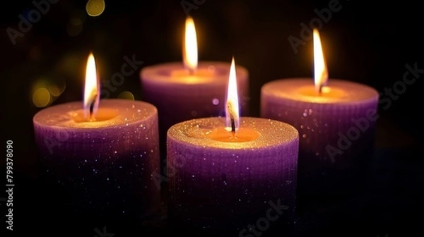 Fototapeta Four purple candles burning in the dark