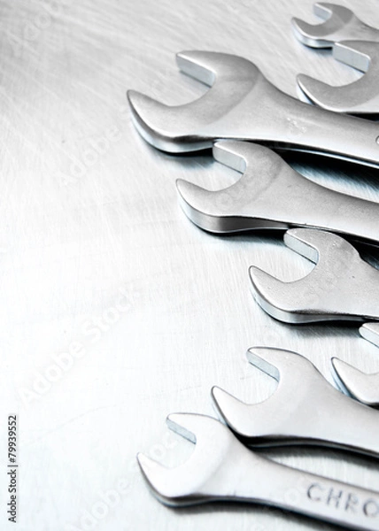 Obraz Wrenches on the scratched metal background.