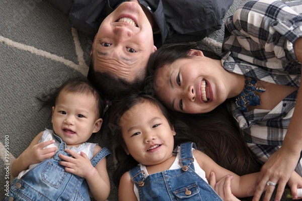 Obraz Asian family smiling and laughing