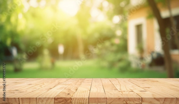 Obraz wooden table space with green home backyard view blur background for advertising template