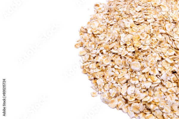 Fototapeta Oatmeal flakes on a white background