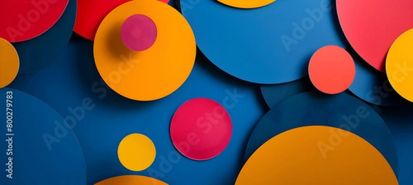 Fototapeta A photograph showcasing a vibrant collection of overlapping geometric shapes, including circles and polygons, set against a deep blue backdrop, taken with a high-definition camera