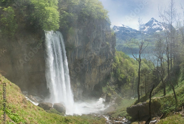 Obraz The Seerenbach Falls in spring with lots of water and a blue sky
