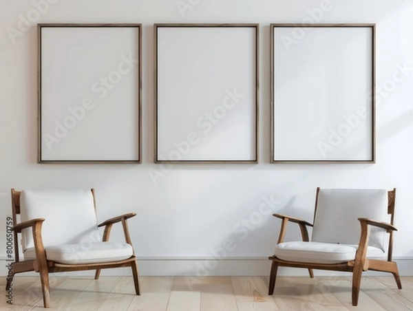 Fototapeta empty poster frames on a white wall in a modern interior apartment, nice and light colors