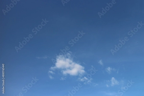 Fototapeta blue sky background with tiny clouds