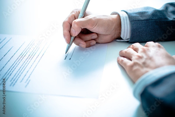 Obraz Business man signing a contract