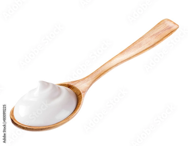 Fototapeta cream sour in wooden spoon isolated white background. Reference for design.
