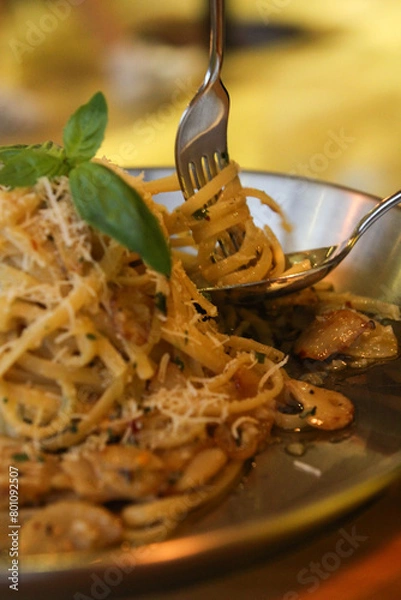 Obraz Rolling pasta with a spoon or fork