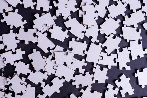 Obraz white deconstructed puzzles on a colored background
