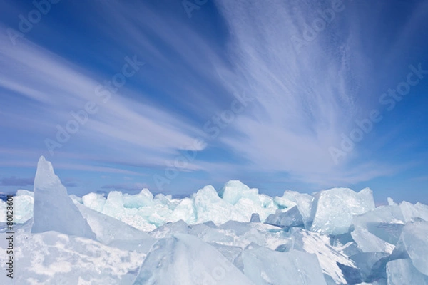Fototapeta Lake Baikal. Stratus clouds over the ice hummocks