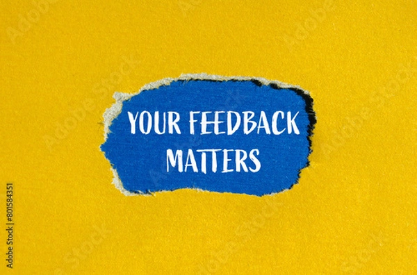 Fototapeta Your feedback matters written on ripped yellow paper with blue background. Conceptual feedback symbol. Copy space.