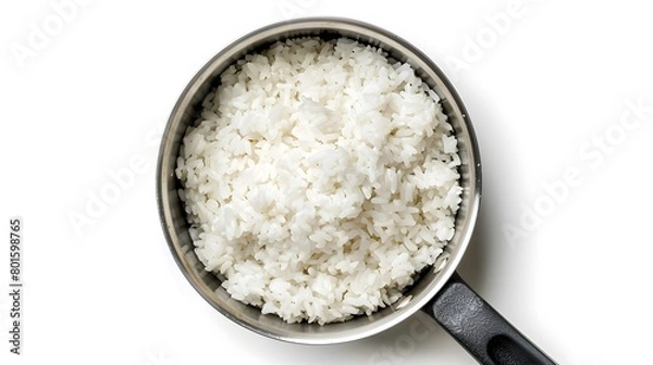 Fototapeta Top view shot capturing rice in a pan.