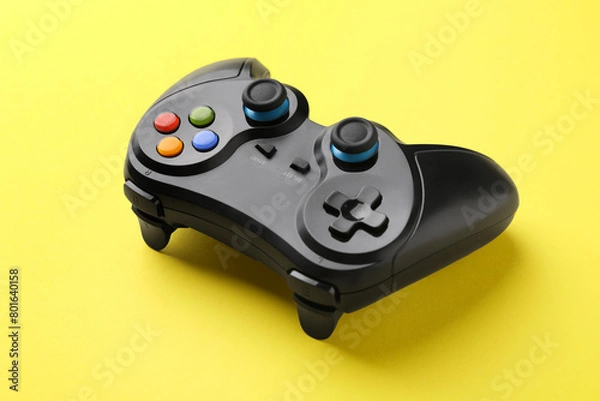 Fototapeta One wireless game controller on yellow background