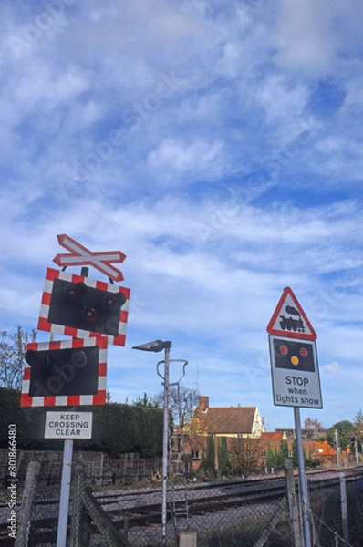 Fototapeta Railway warning and guidance furniture for train drivers. level crossing sign. train approaching lights. rail tracks Location Woodbridge Railway station Suffolk UK 2003