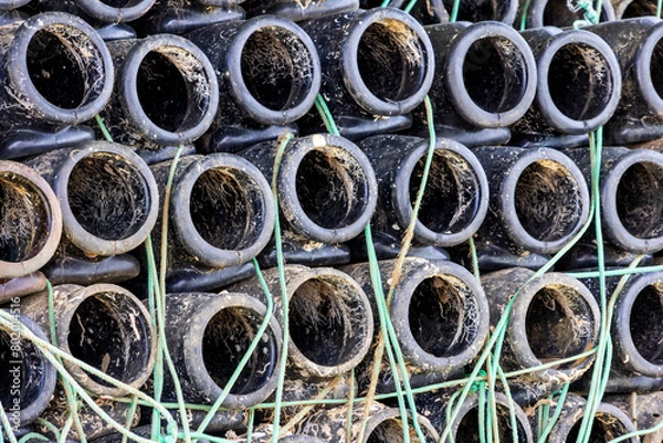 Fototapeta Container used to catch octopuses in the fishing port of Santa Luzia in Portugal