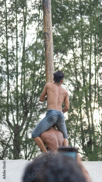 Fototapeta Panjat Pinang is one of the competitions to commemorate the independence of the Republic of Indonesia
