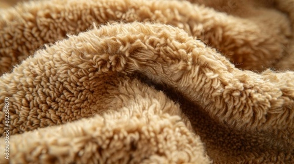 Fototapeta Fuzzy wool in a warm camel color lends a cozy and inviting texture to your design.