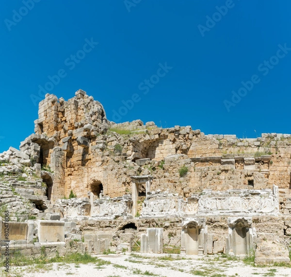 Obraz Picturesque ruins of an amphitheater in the ancient city of Perge, Turkey. Perge open-air museum.