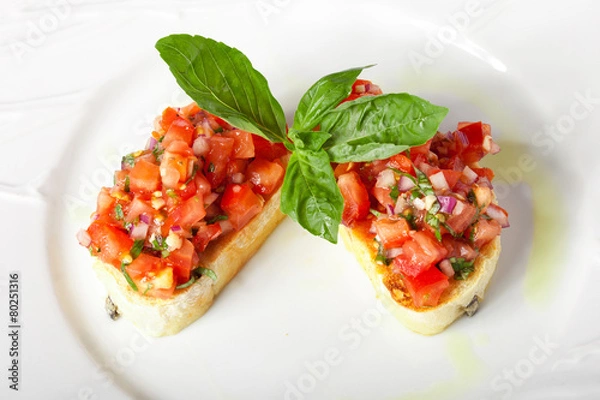 Obraz Bruschetta with red tomatoes and green basil