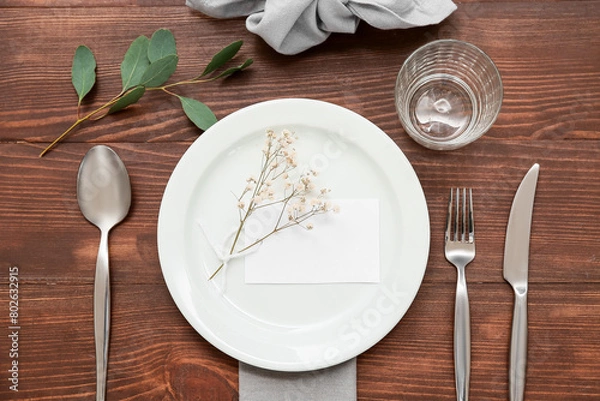 Obraz Beautiful table setting with gypsophila flowers and leaves on wooden background