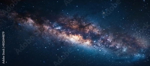 Fototapeta Capturing a detailed view of a vast galaxy, filled with numerous sparkling stars, set against a deep and dark night sky