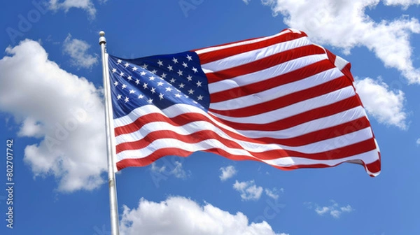 Obraz American flag waving against blue sky with clouds