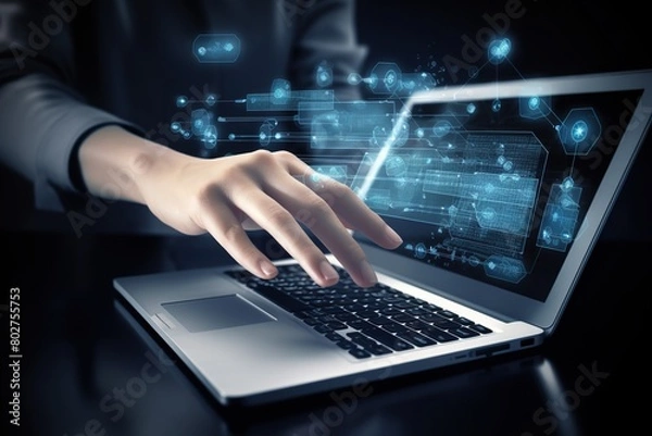 Fototapeta a person is using a laptop with a hand on the keyboard.