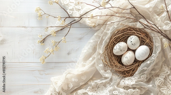 Fototapeta easter egg in a nest white cloth and background