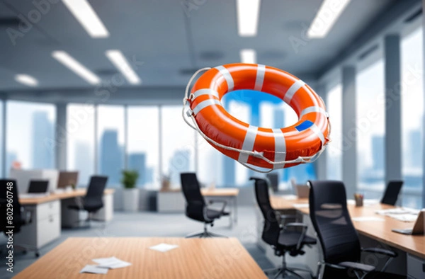 Fototapeta lifebuoy in the world of finance and business, floating in the air with blurred office space background