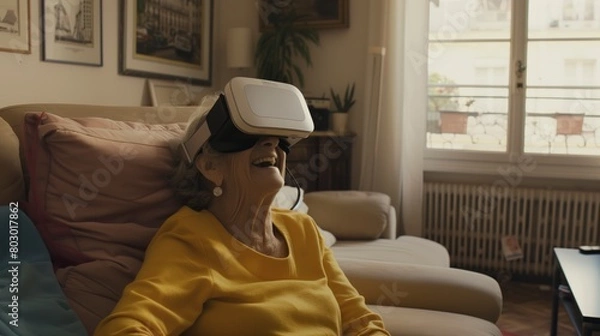 Fototapeta  Senior woman experiencing virtual reality at home