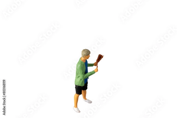 Fototapeta Miniature people , A young man with a BBQ Isolated on white background with clipping path