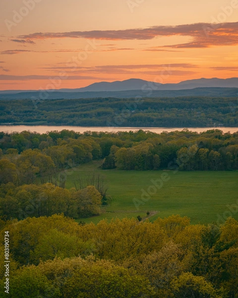 Fototapeta Sunset view over the Hudson River from the fire tower on Mount Rutsen, in Ferncliff Forest, Rhinebeck, New York