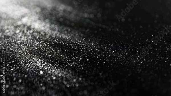 Fototapeta Dark and mysterious black grainy gradient with a noise texture, perfect for blurred background elements in headers, posters, and banner designs