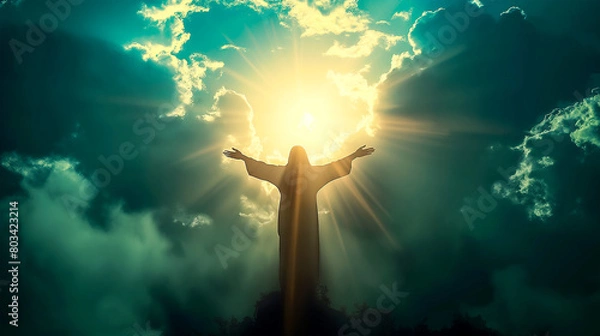 Obraz Silhouette of Jesus with arms raised up towards the sky in sign of redemption and spirituality.